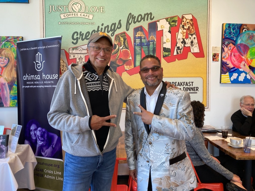 C. Magic with guest at Just Love Coffee Cafe Ahimsa House event