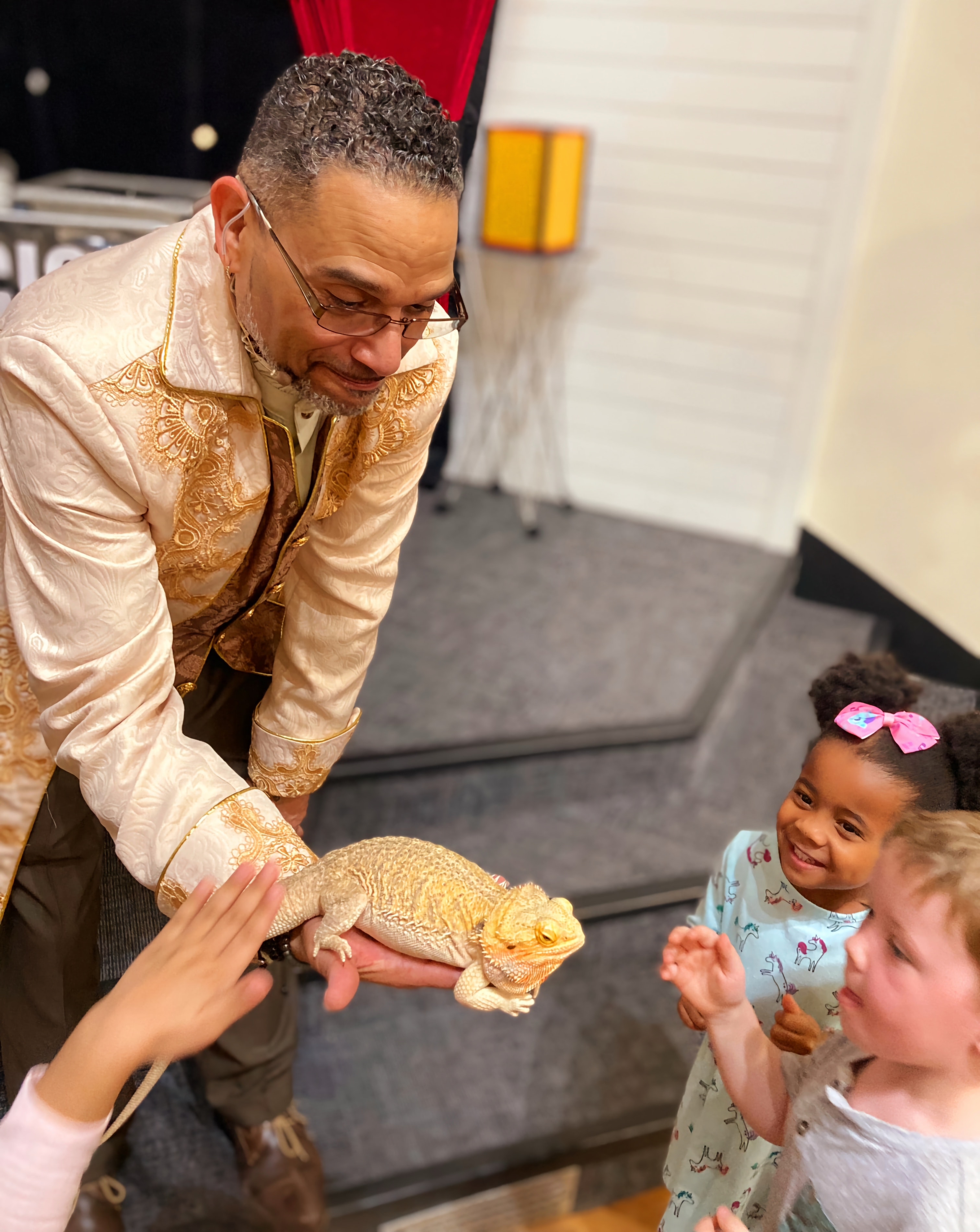 C. Magic showing bearded dragon to children at birthday party